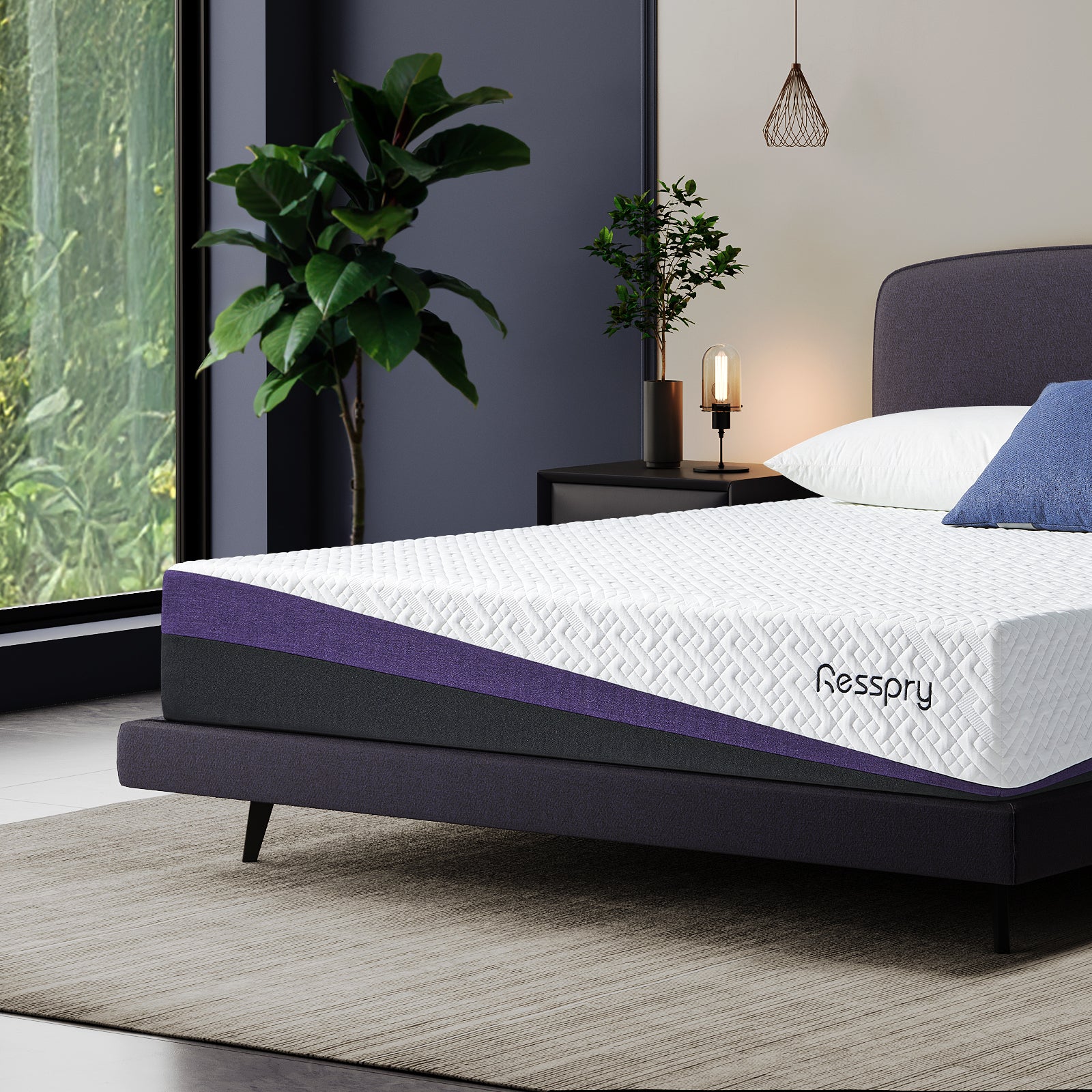 Resspry mattress on a bed in a modern bedroom with plants and a window. The gel memory foam mattress disperses heat while contouring to your body for deeper relaxation.